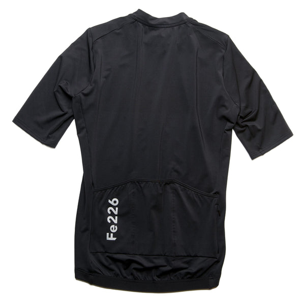 "The Fe226 Black Cycling Jersey combines an aerodynamic race fit with a comfortable feel, featuring three back pockets, a zipped security pocket, and reflective logo prints for enhanced visibility in low-light conditions. This high-quality, odorless summer cycling jersey is perfect for road cycling, gravel riding, mountain biking, triathlon training, commuting, and racing."