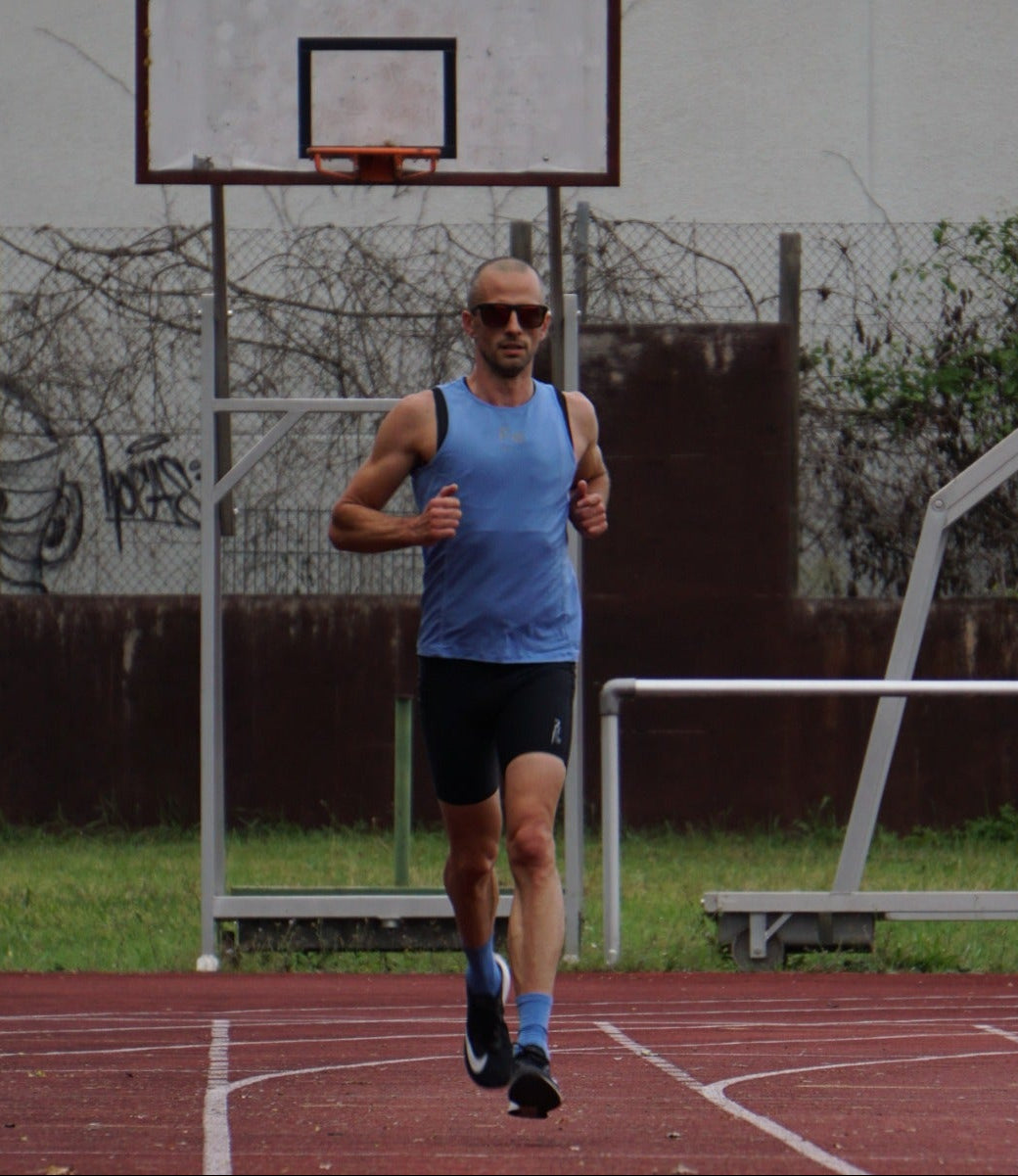 "Experience the ultimate in running comfort with THE RUNNING SINGLET from Fe226. Our unique four-panel construction ensures the perfect fit, while lightweight, quick-drying, and ventilated fabric keeps you comfortable throughout your run. Enjoy high-quality, odor-free performance with Fe226."