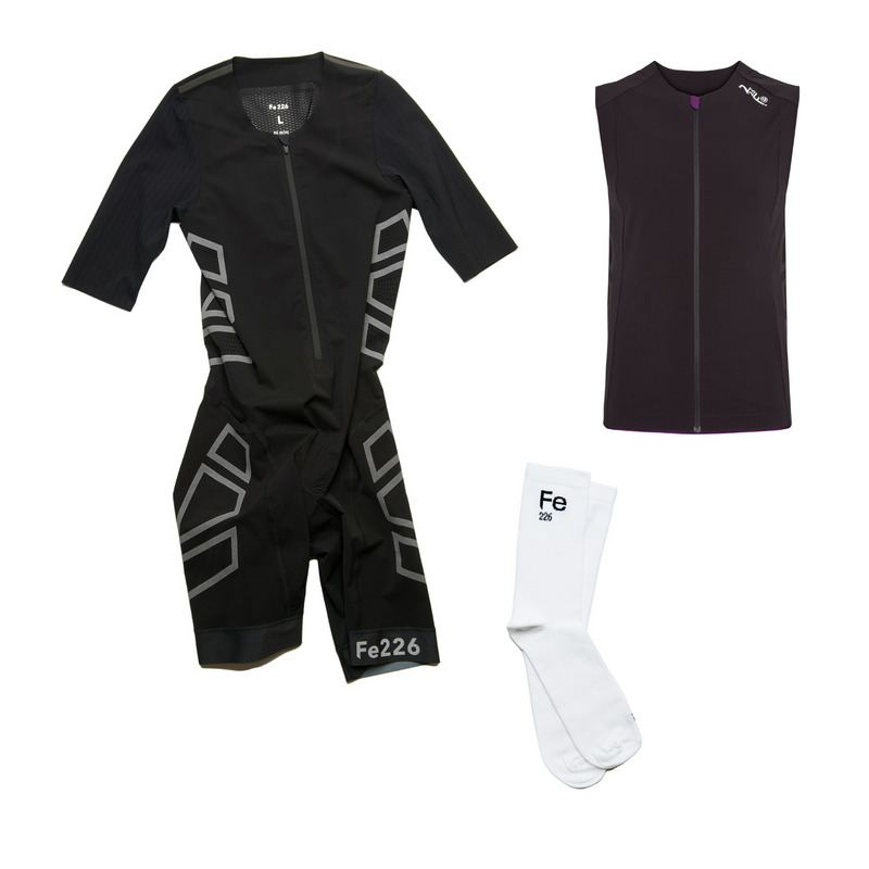 Enhance your racing performance with the Fe226 Triathlon AeroForce Race Bundle. This bundle includes the top-performing AeroForce triathlon suit, scientifically proven to increase speed across all three disciplines. Pair it with the AeroForce wind vest, made from the same fabric, and complete the look with white Fe226 socks for optimal performance and style during any competition, from sprints to long-distan