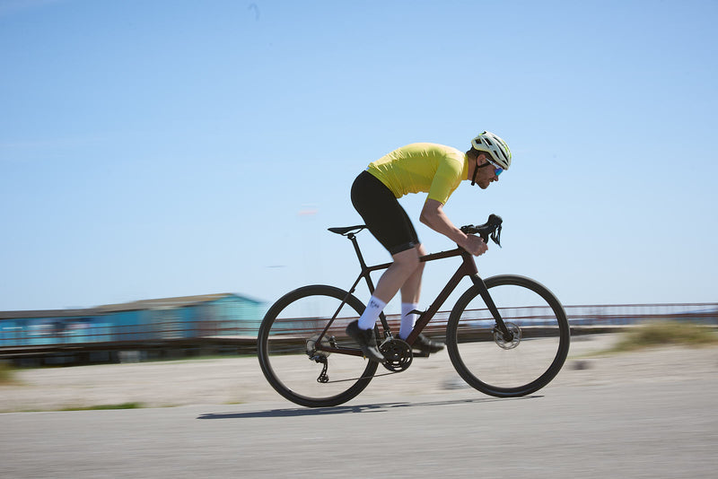 "The Fe226 High Visibility Cycling Jersey boasts an aerodynamic race fit, three back pockets, a zipped security pocket, and reflective logo prints for enhanced visibility in low-light conditions. This premium, odorless summer cycling jersey is ideal for road cycling, gravel riding, mountain biking, triathlon training, commuting, and racing."